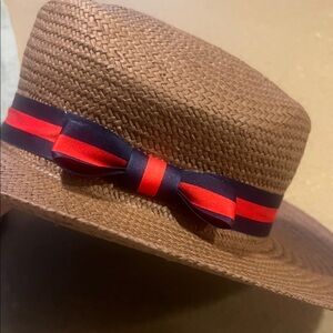 Stylish Brown Straw Hat with Red and Black Ribbon